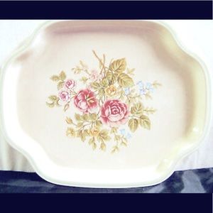 Vintage Avon metal tray featuring a floral design, likely from the 1980s